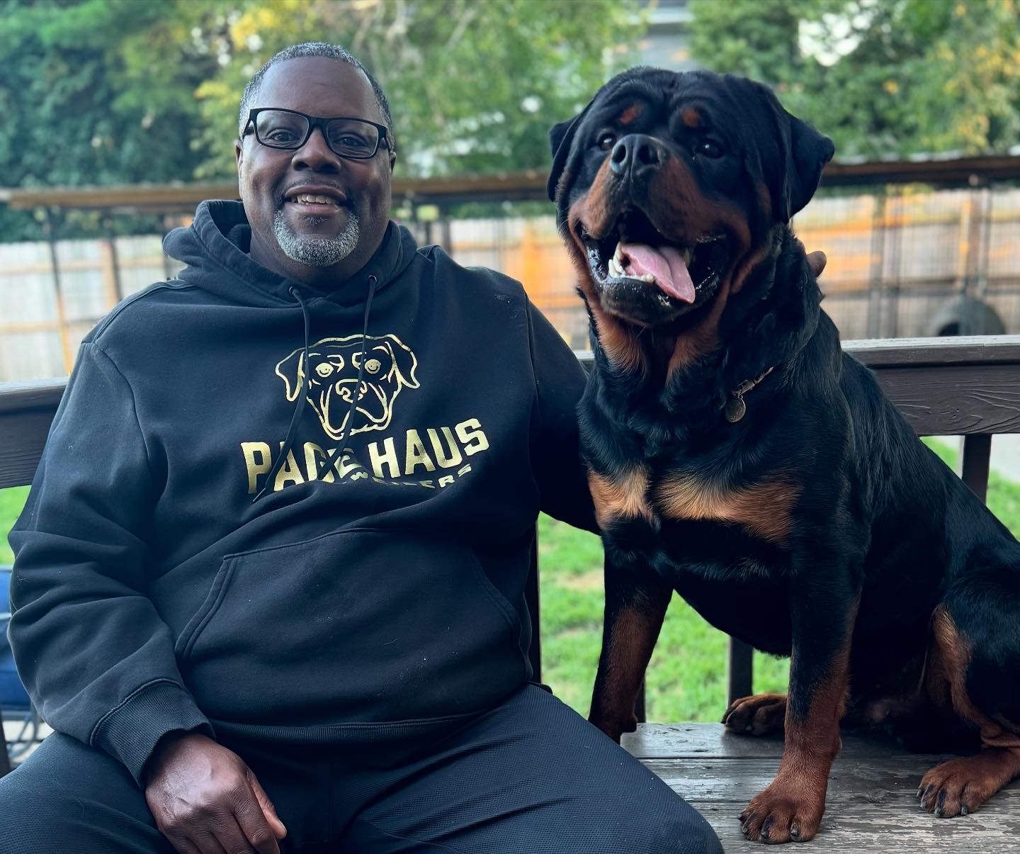 Owner Will Page sitting with a Page Haus Rottweiler